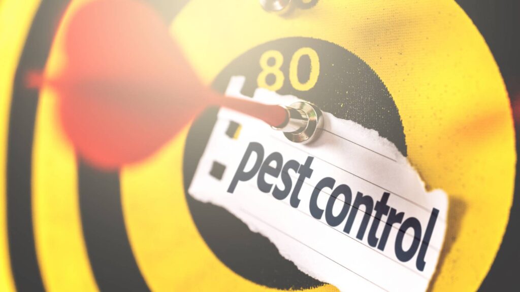 a dartboard with a pest control note