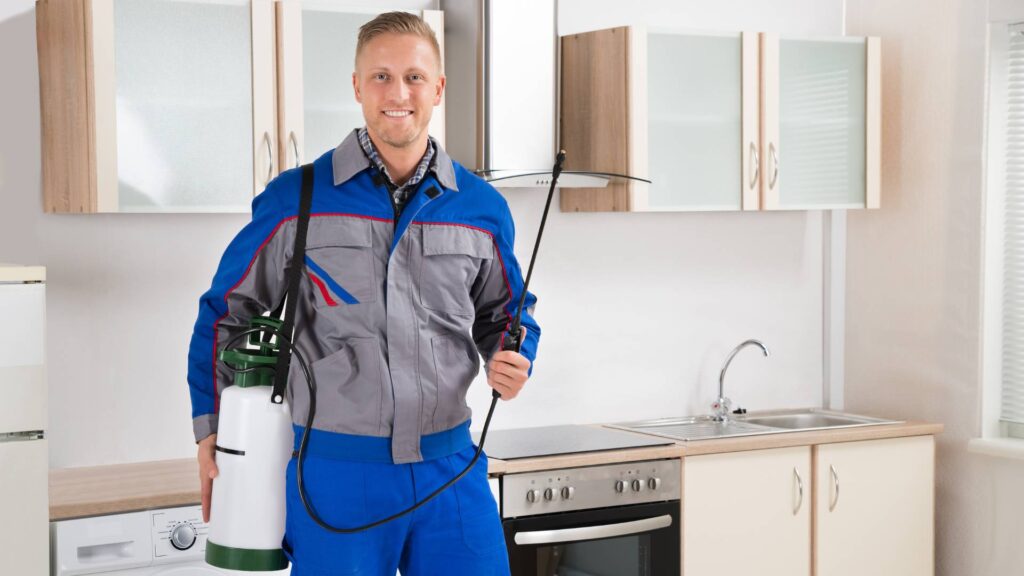 a pest control technician implementing safe pest control methods for infants inside the house