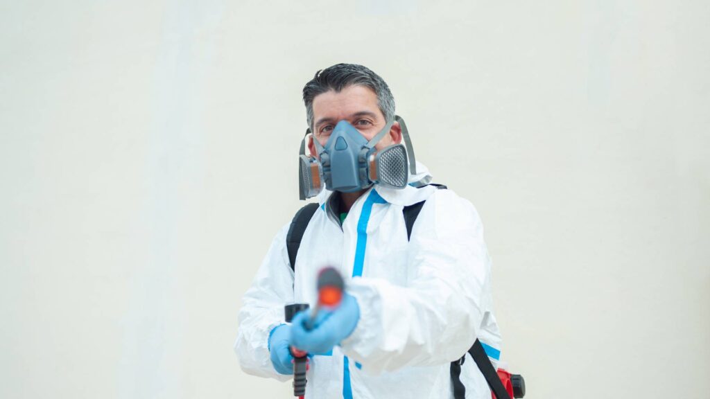 man with a fumigation gun to illustrate the breakdown the cost of fumigation in pest control.