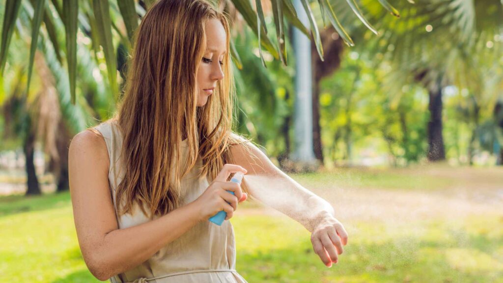 girl spraying peppermint oil on her arm will that get rid of ants?