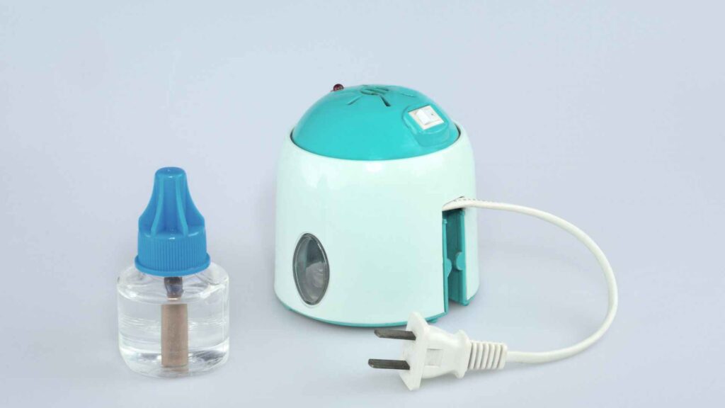 a small white and blue device with a plug and a clear bottle as the best mosquito killer for bedroom