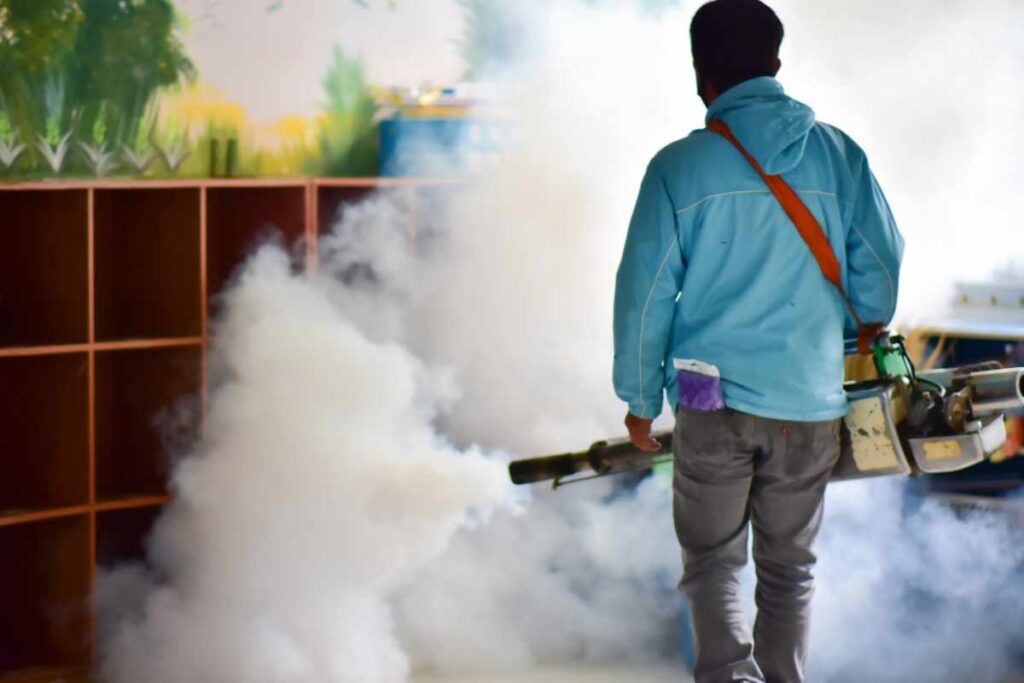 man using chemicals to fight mosquito as one of the effective methods to combat mosquito infestation in house 